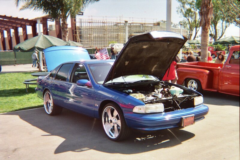 Blue Sedan at Car Show