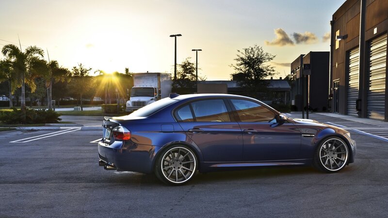 blue sedan at sunset