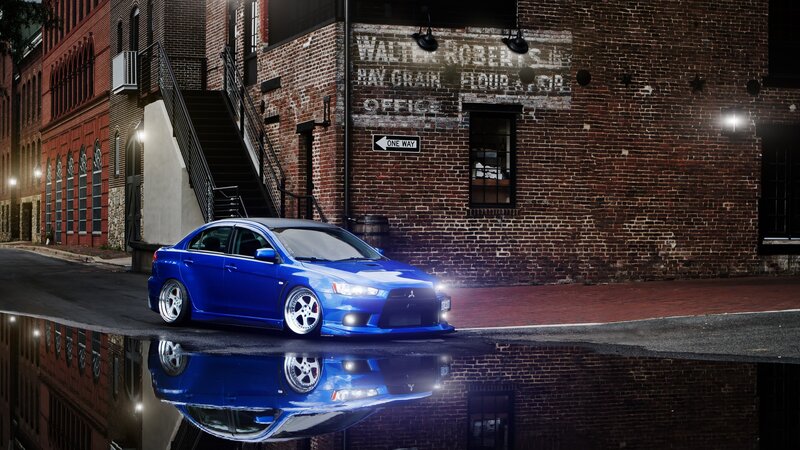 Blue Sedan Car — Dramatic, Night, Photograph, Brick Building