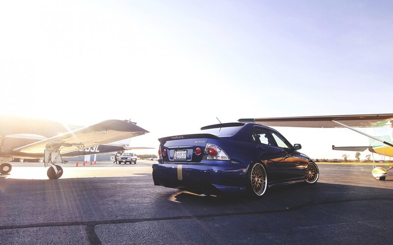 Blue Sedan Car — Dramatic, Sunset