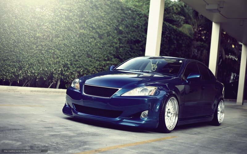 blue sedan car in parking lot