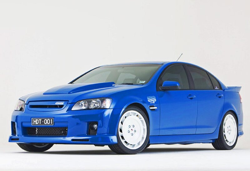Blue Sedan Car — Neutral, Photograph, White Wheels