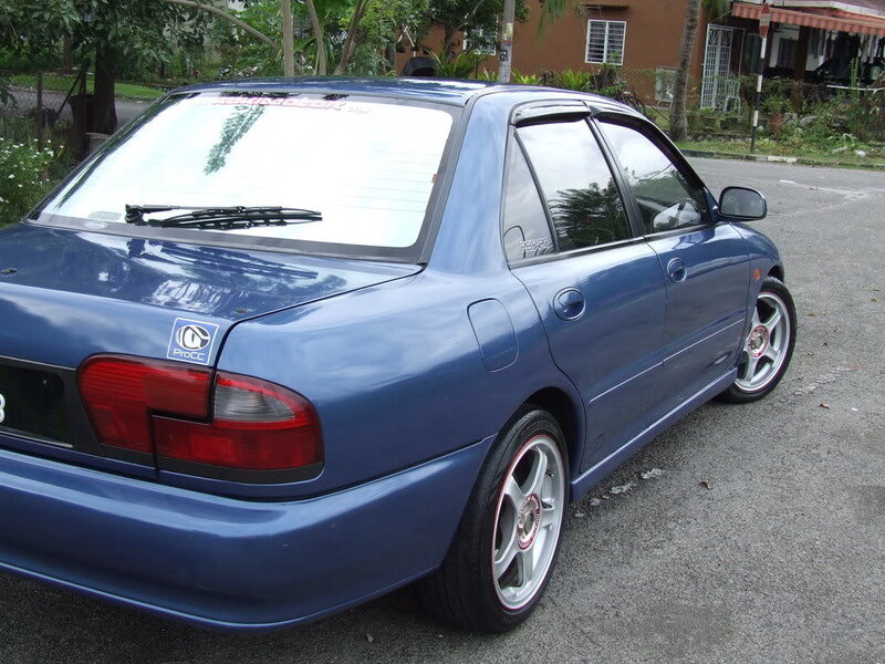 blue sedan car parked