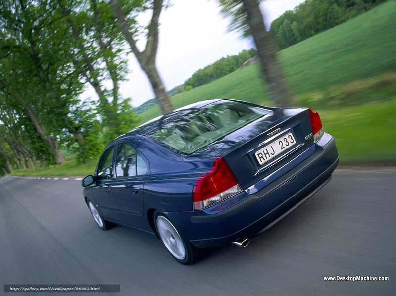 blue sedan driving on country road