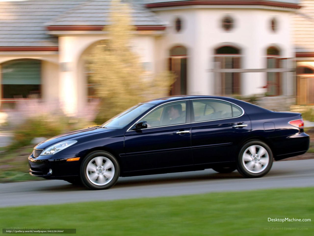 blue sedan driving on road