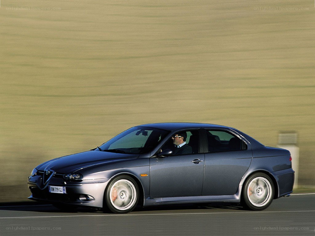 blue sedan in motion