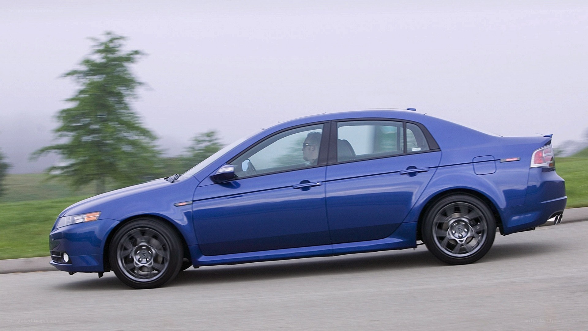 blue sedan in motion