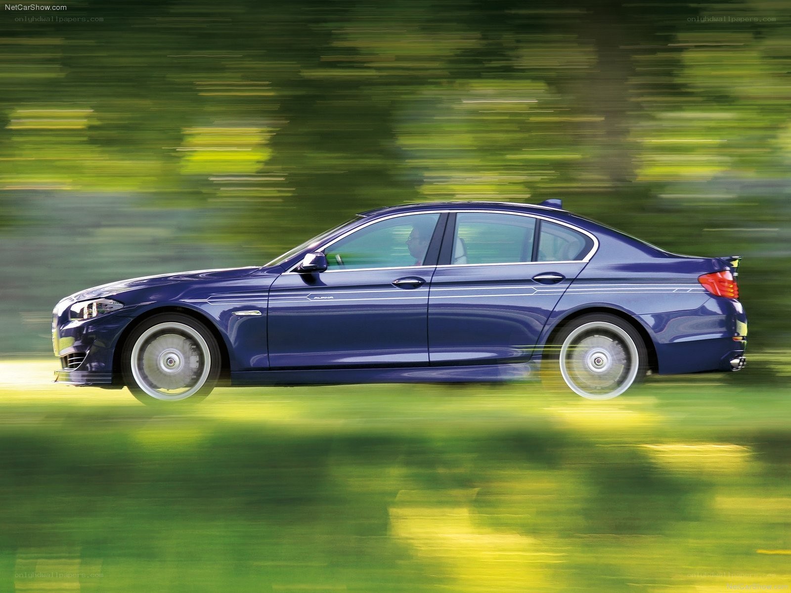 blue sedan in motion