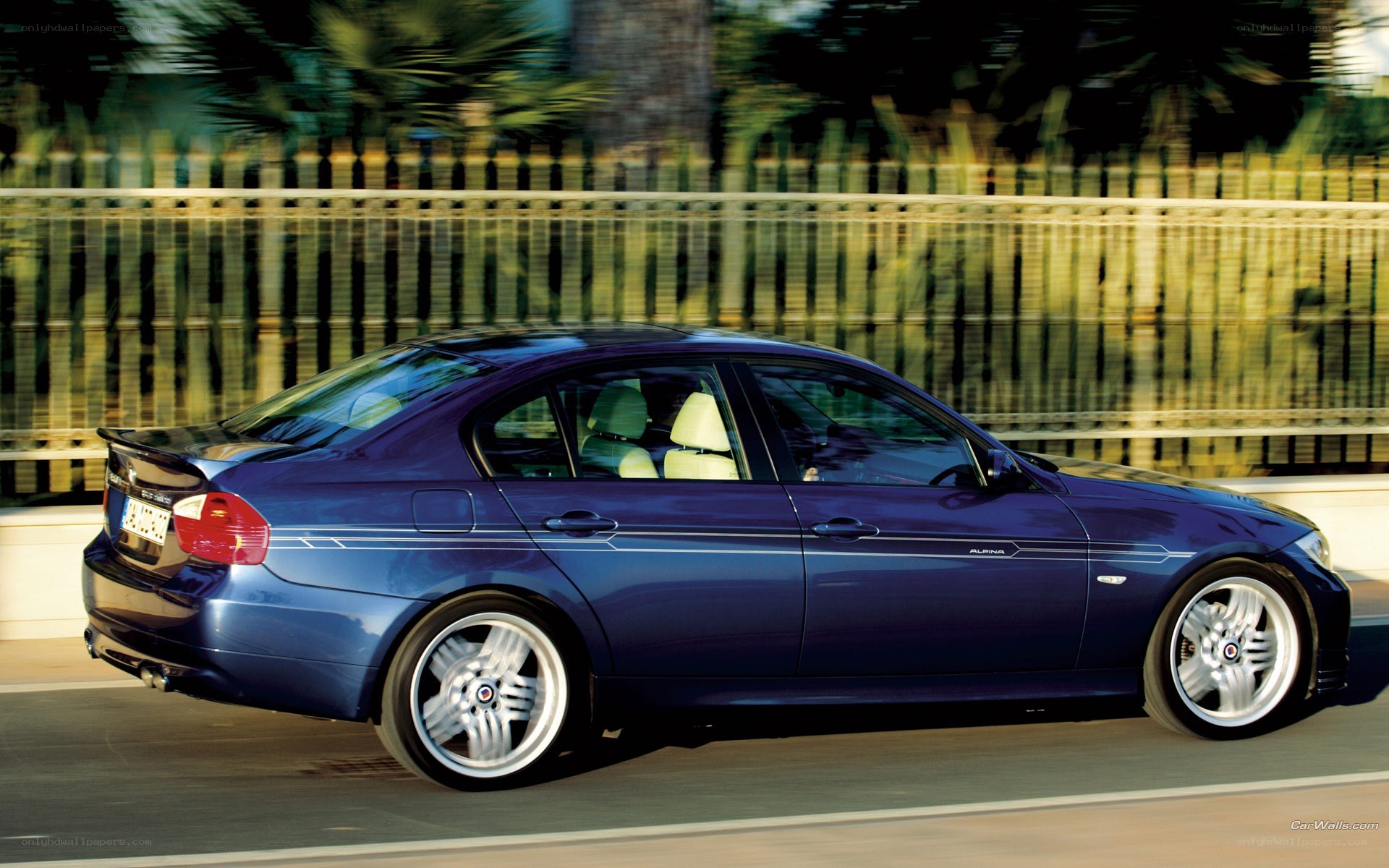 blue sedan in motion