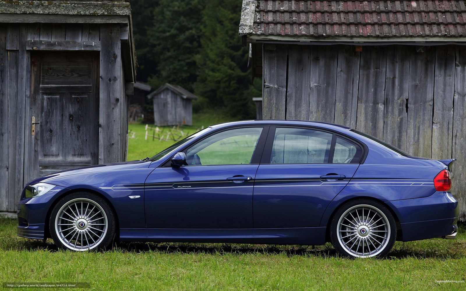 blue sedan in rural setting