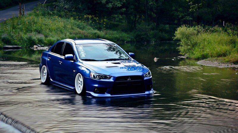 Blue Sedan in Water