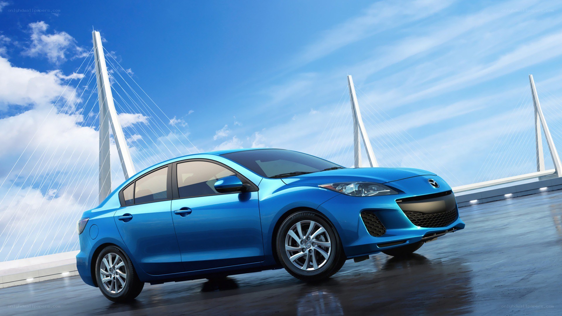 Blue sedan on a bridge