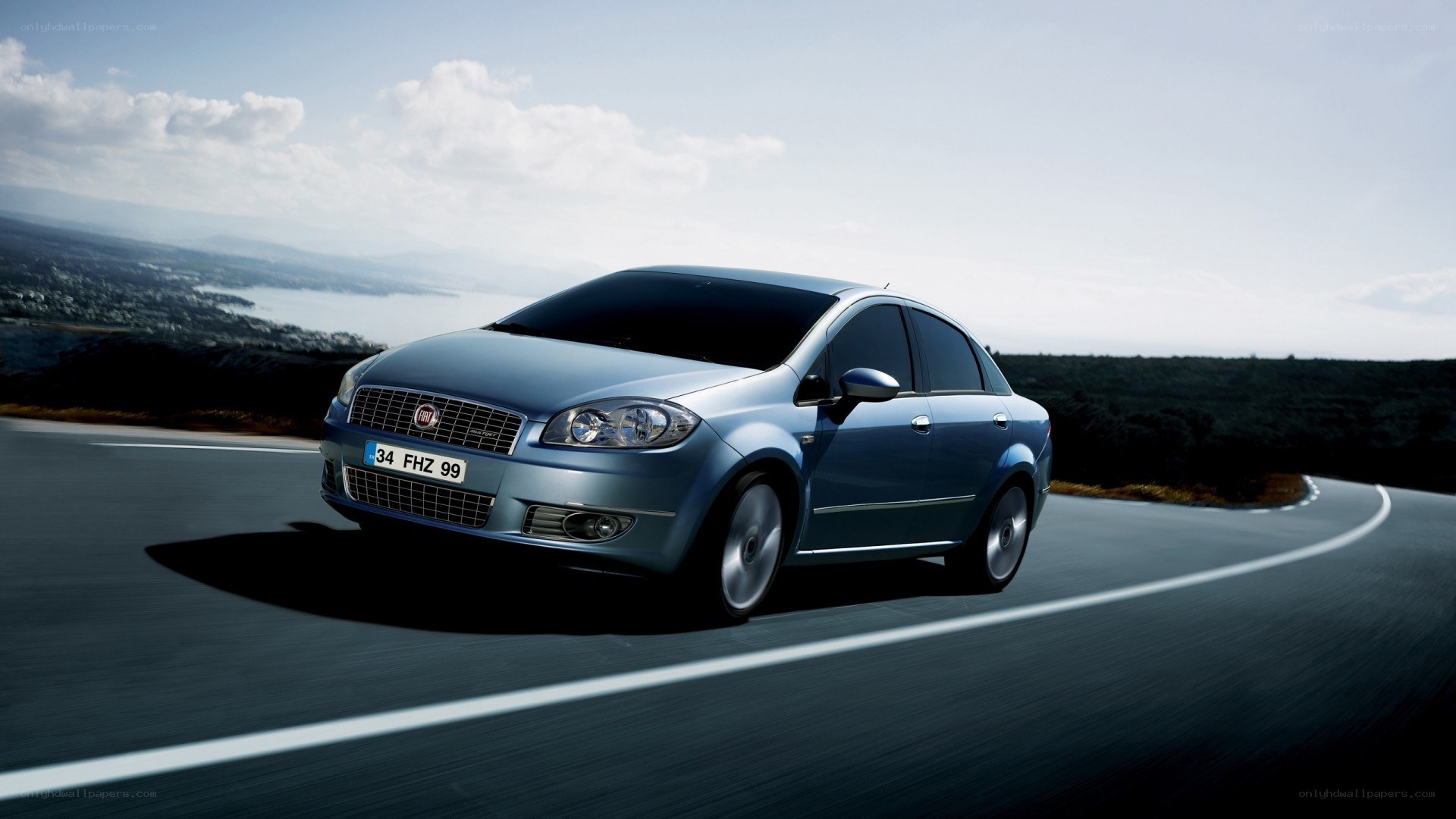 Blue sedan on a winding road