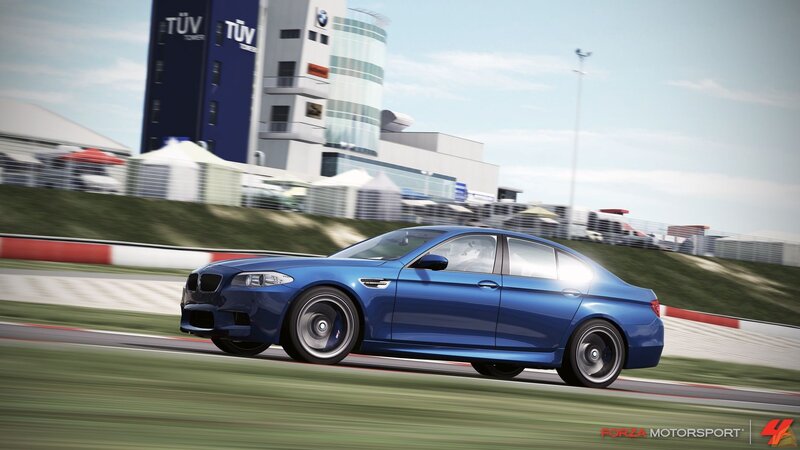 Blue Sedan on Racetrack