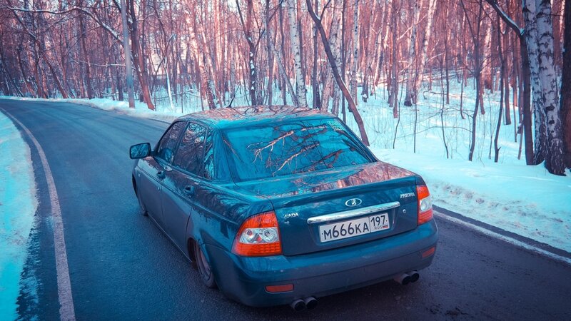 Blue Sedan on Road