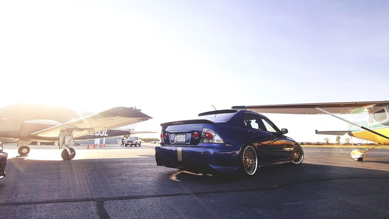 Blue Sedan on Tarmac