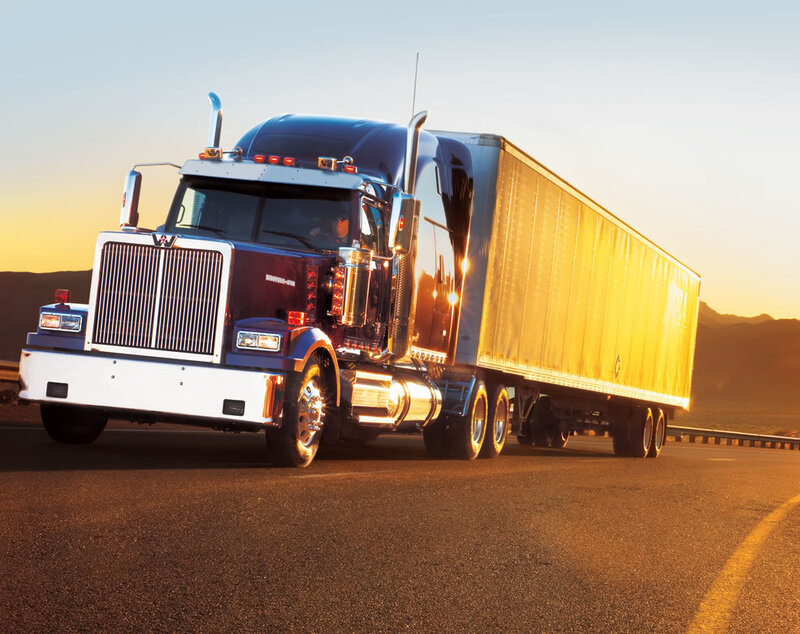 Blue Semi-truck on Highway — Dramatic