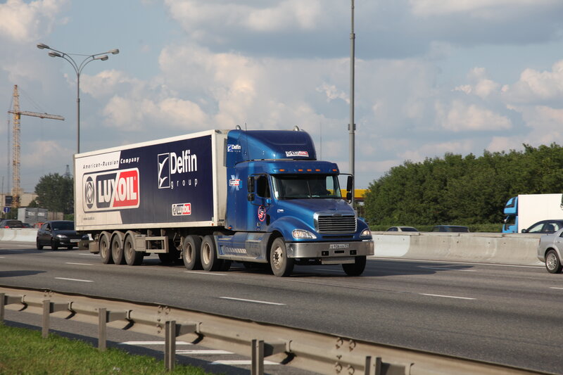 Blue semi-truck on highway
