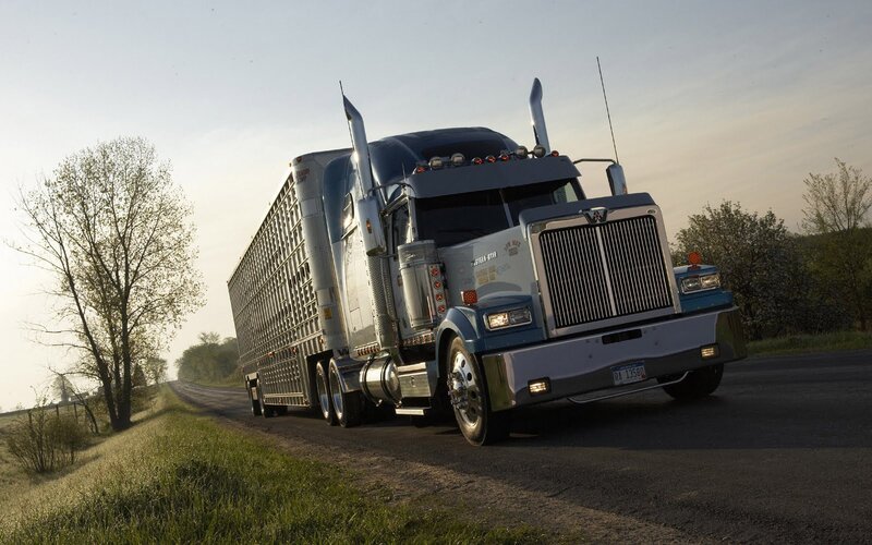 Blue Semi-truck on Road — Dramatic