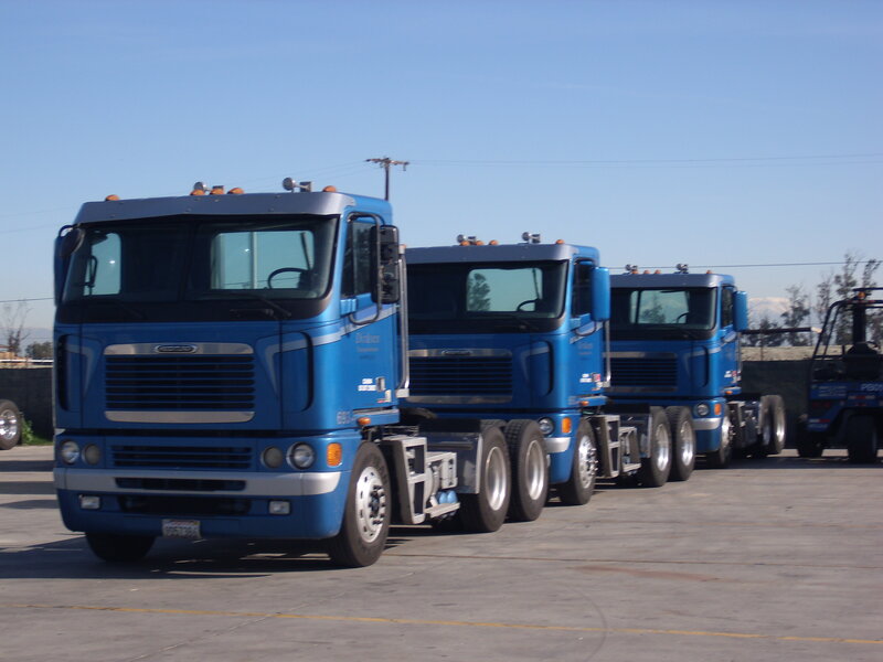 Blue Semi-trucks in Line