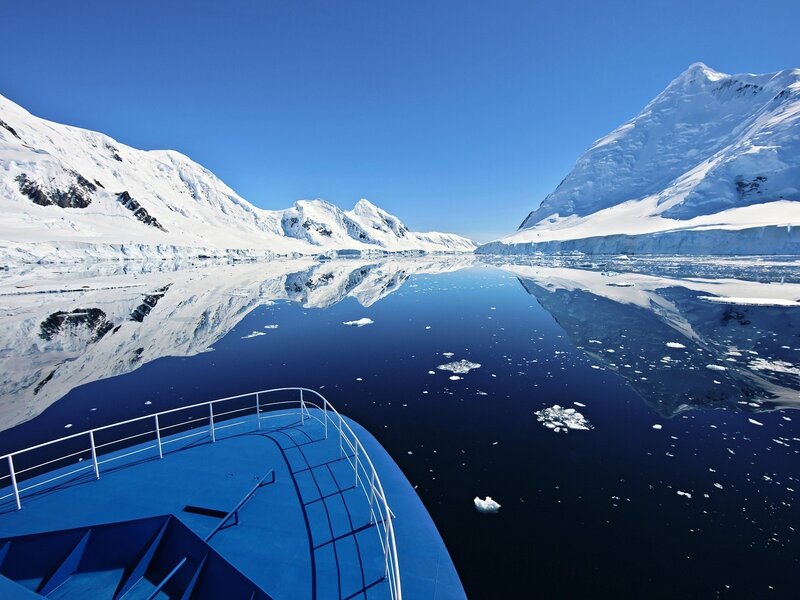 Blue Ship in Icy Water — Serene