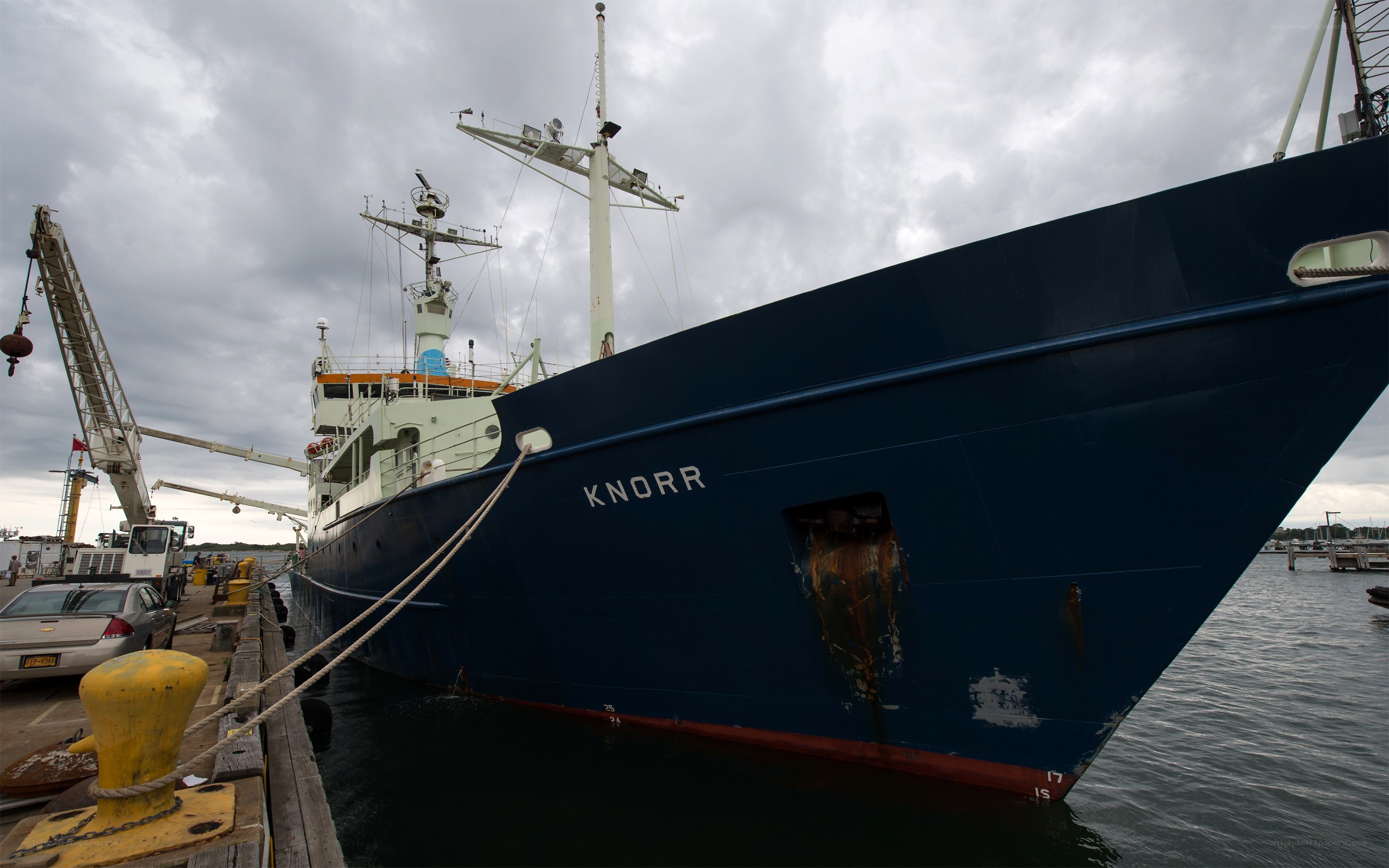 Blue ship named Knorr at dock