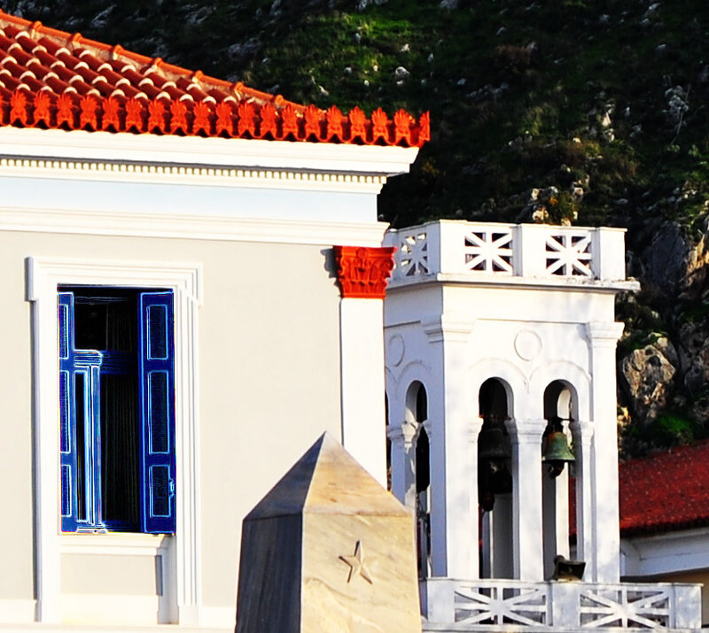 Blue-shuttered building with bell tower