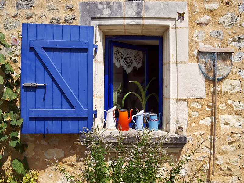Blue Shuttered Window