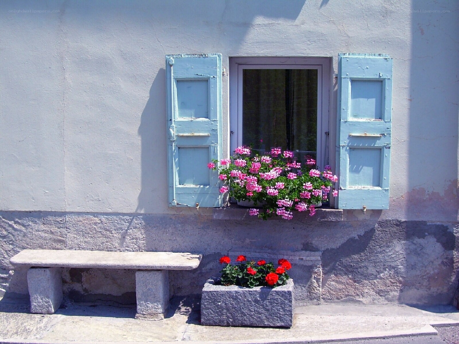 Blue shutters with flowers