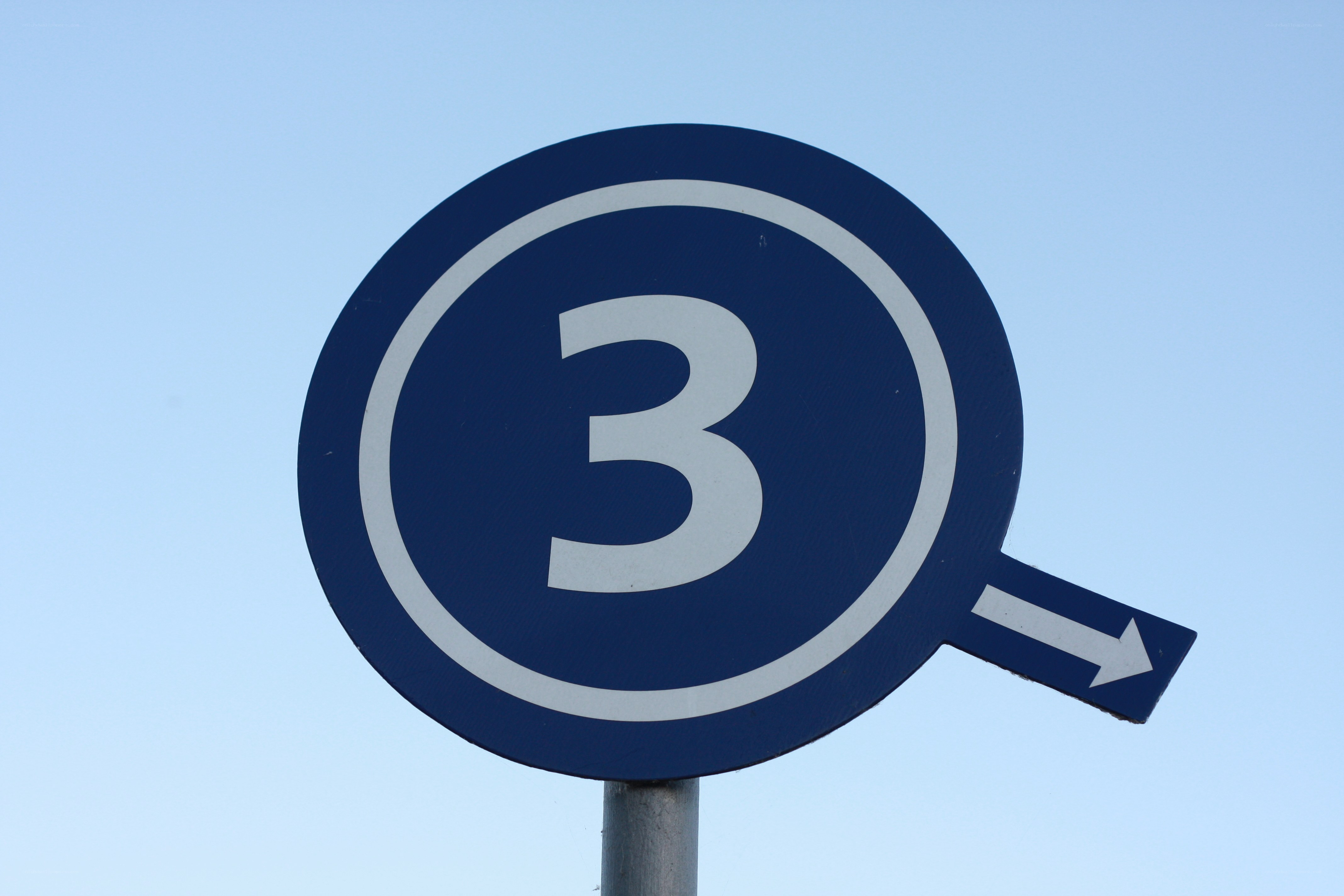 blue sign with number three