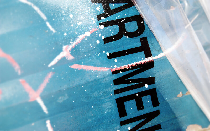 blue sign with spray paint