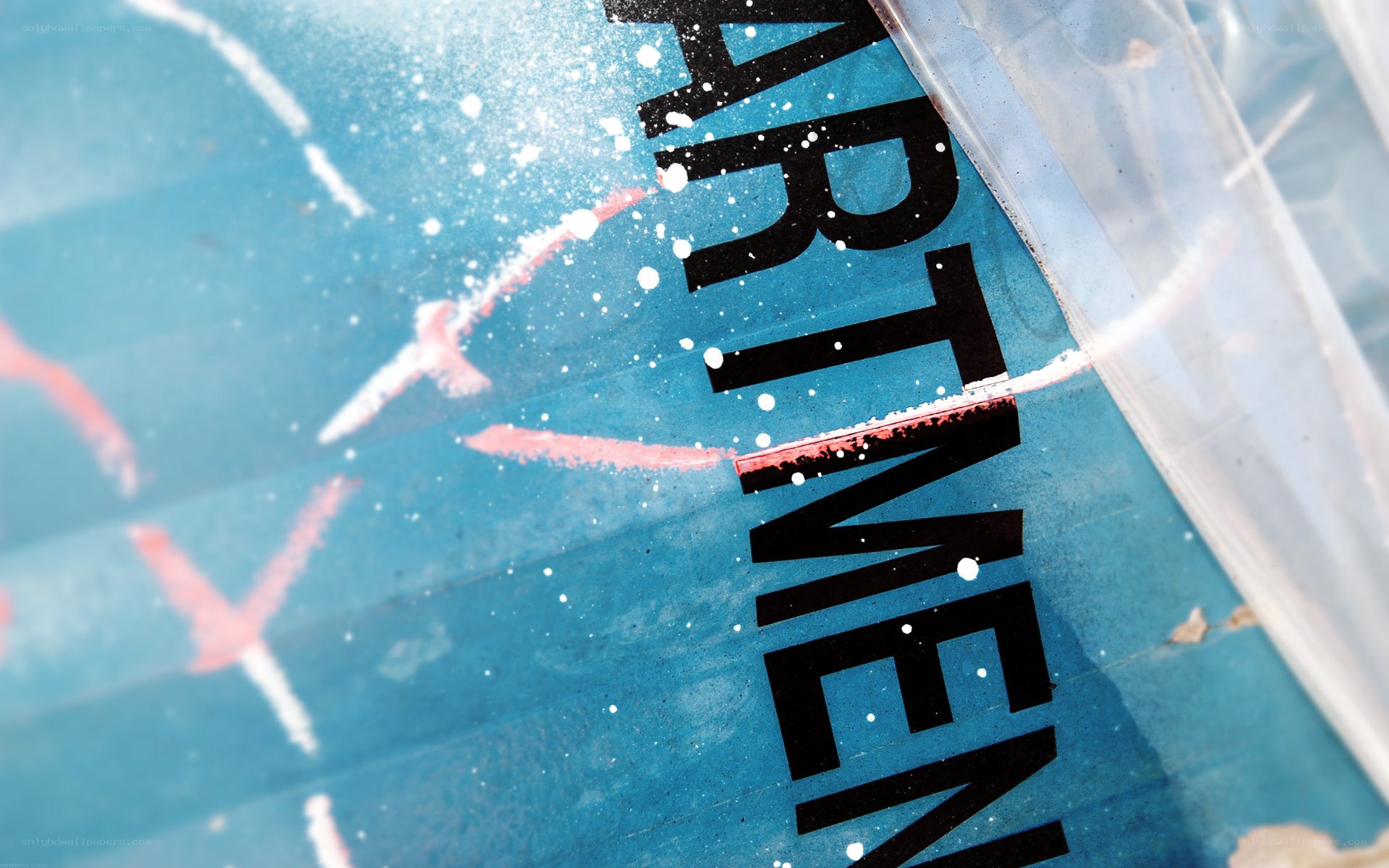 blue sign with spray paint