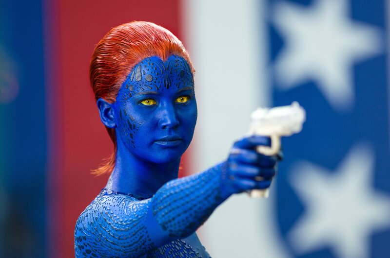 Blue-skinned woman holding a gun