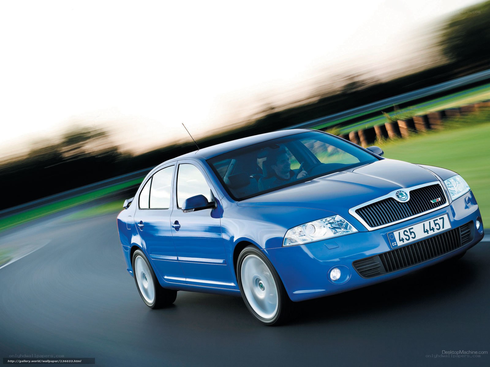 blue skoda sedan in motion