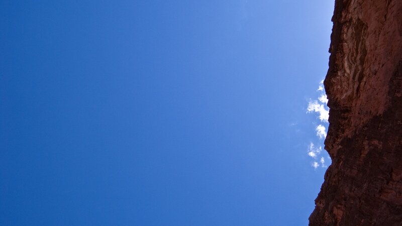 blue sky above canyon wall