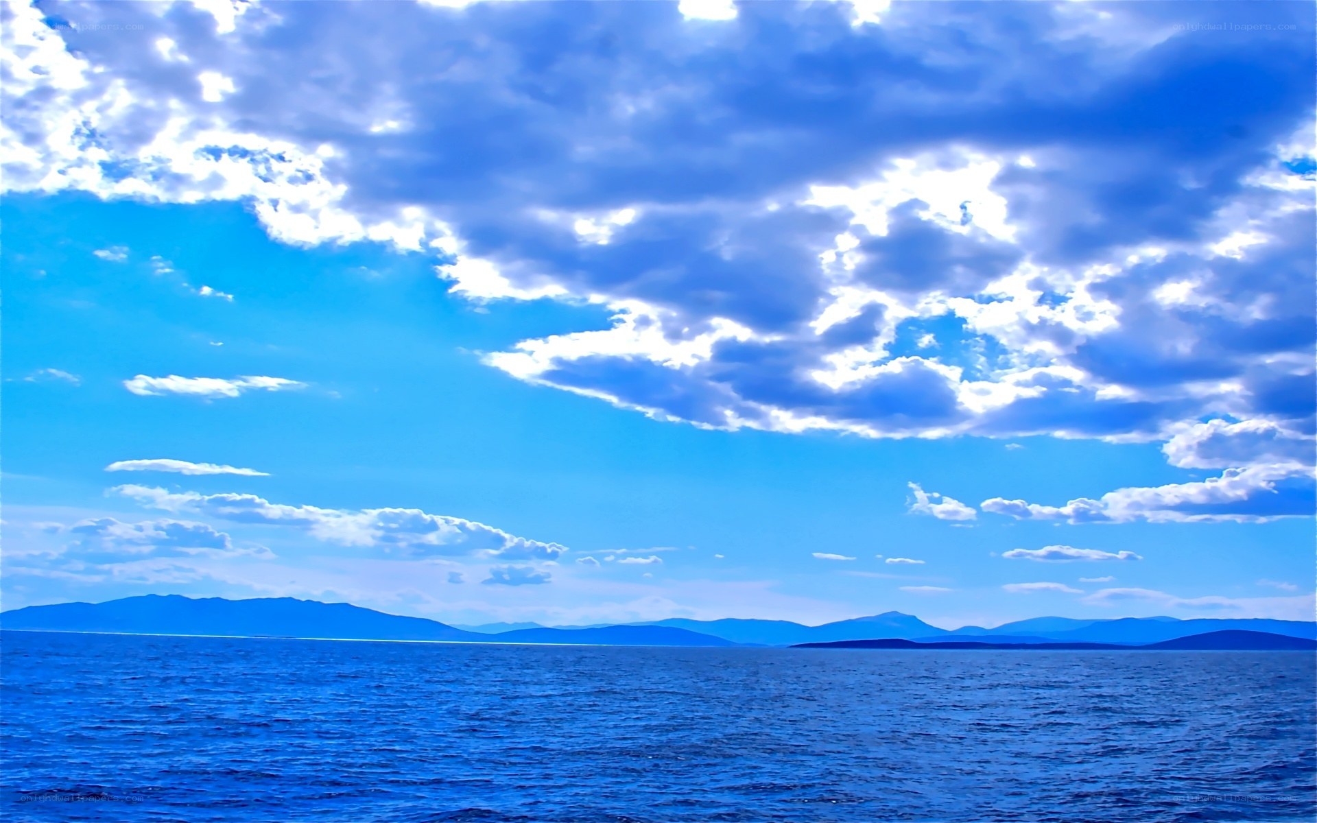 Blue sky over a vast lake