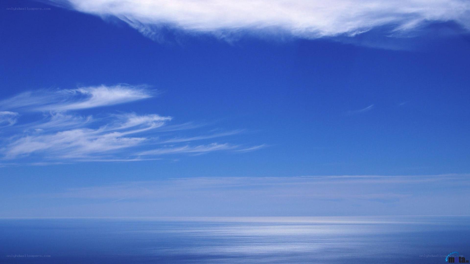 Blue sky over calm ocean