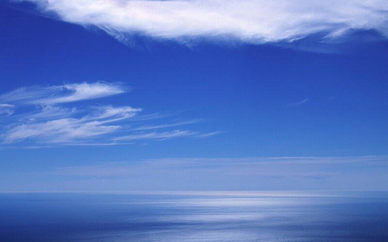 Blue sky over calm ocean