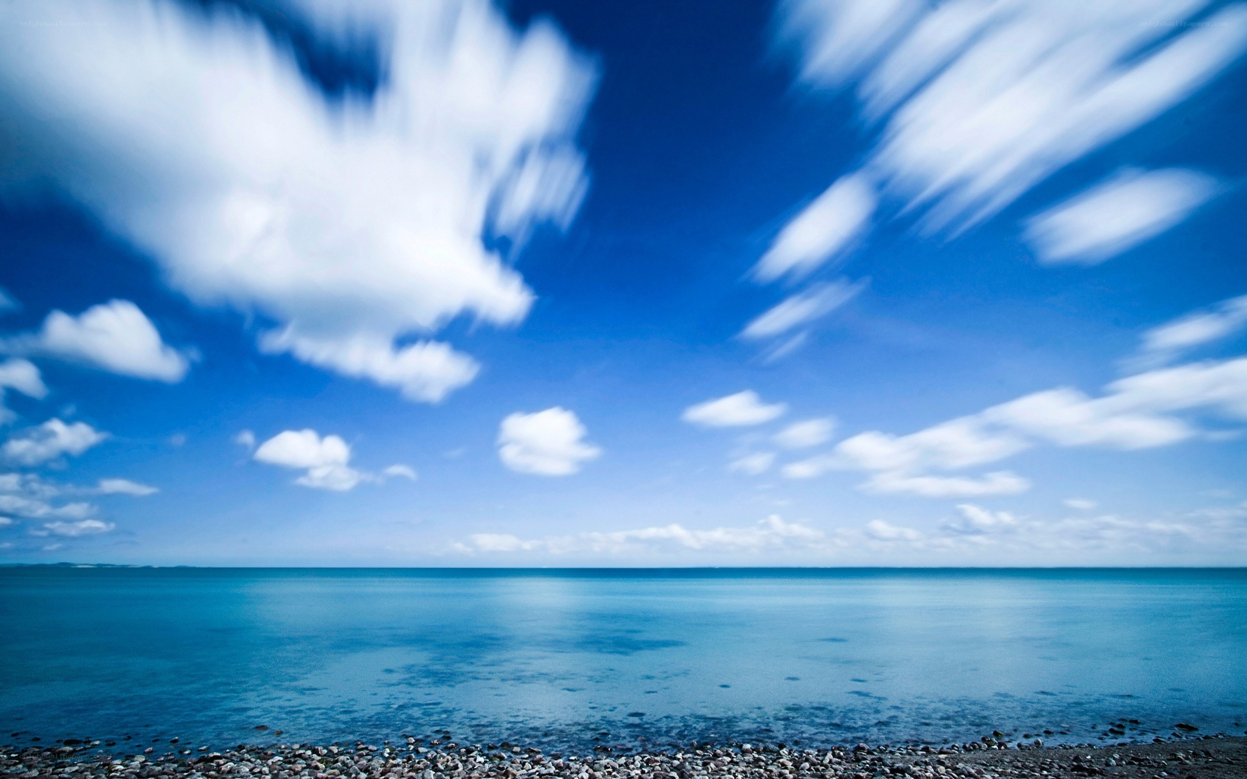 Blue sky over calm sea