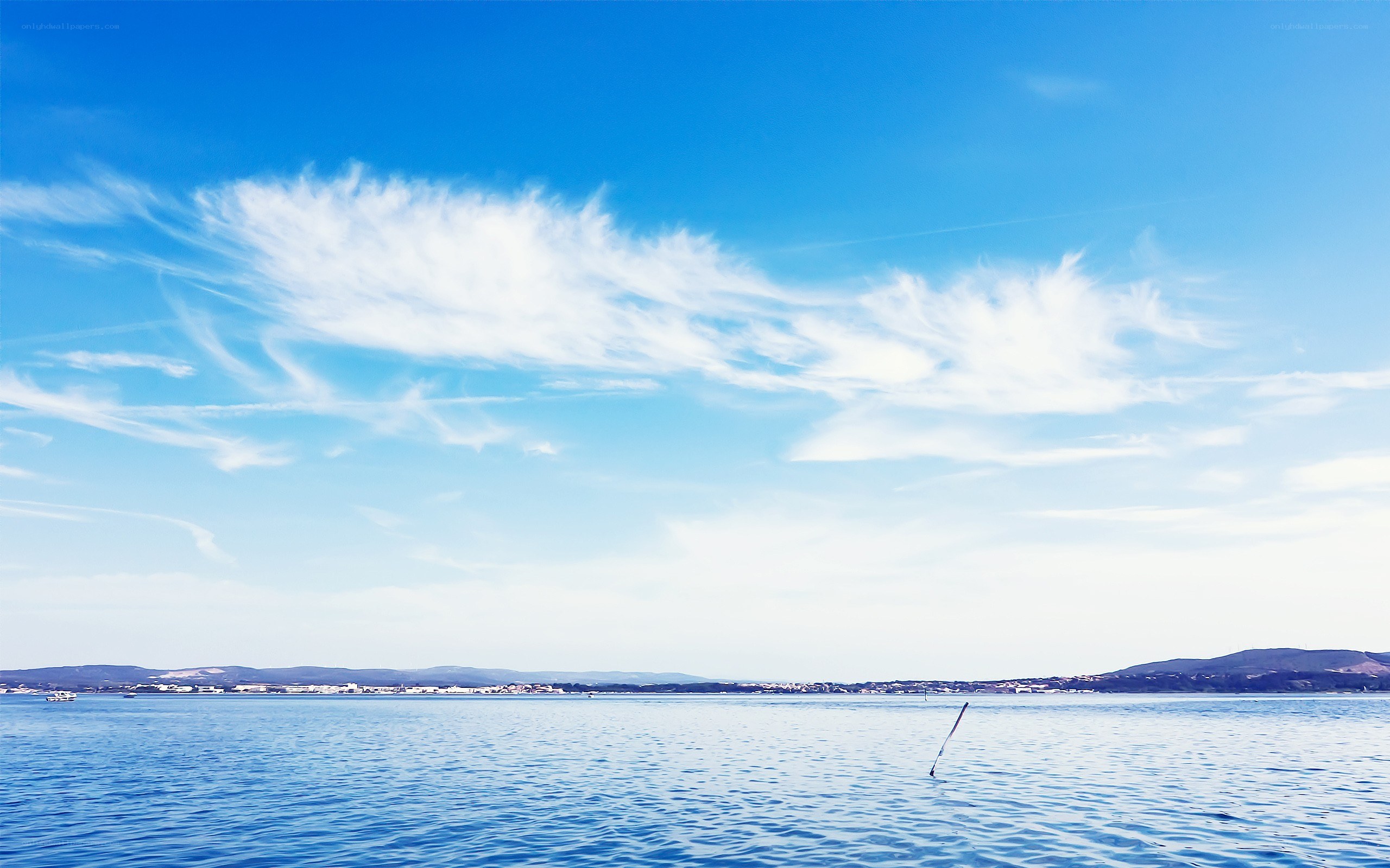 Blue sky over calm sea