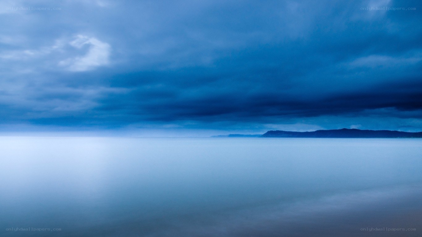Blue sky over calm sea