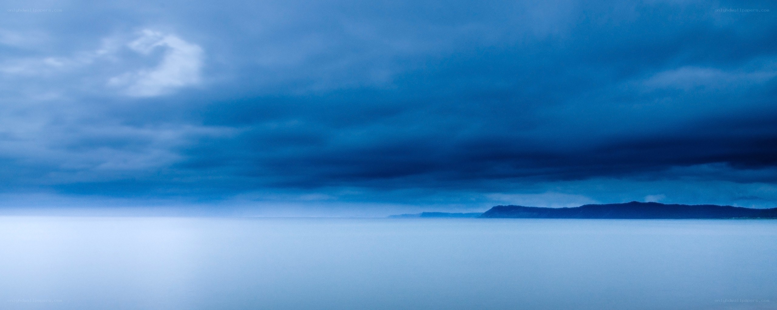 Blue sky over calm sea