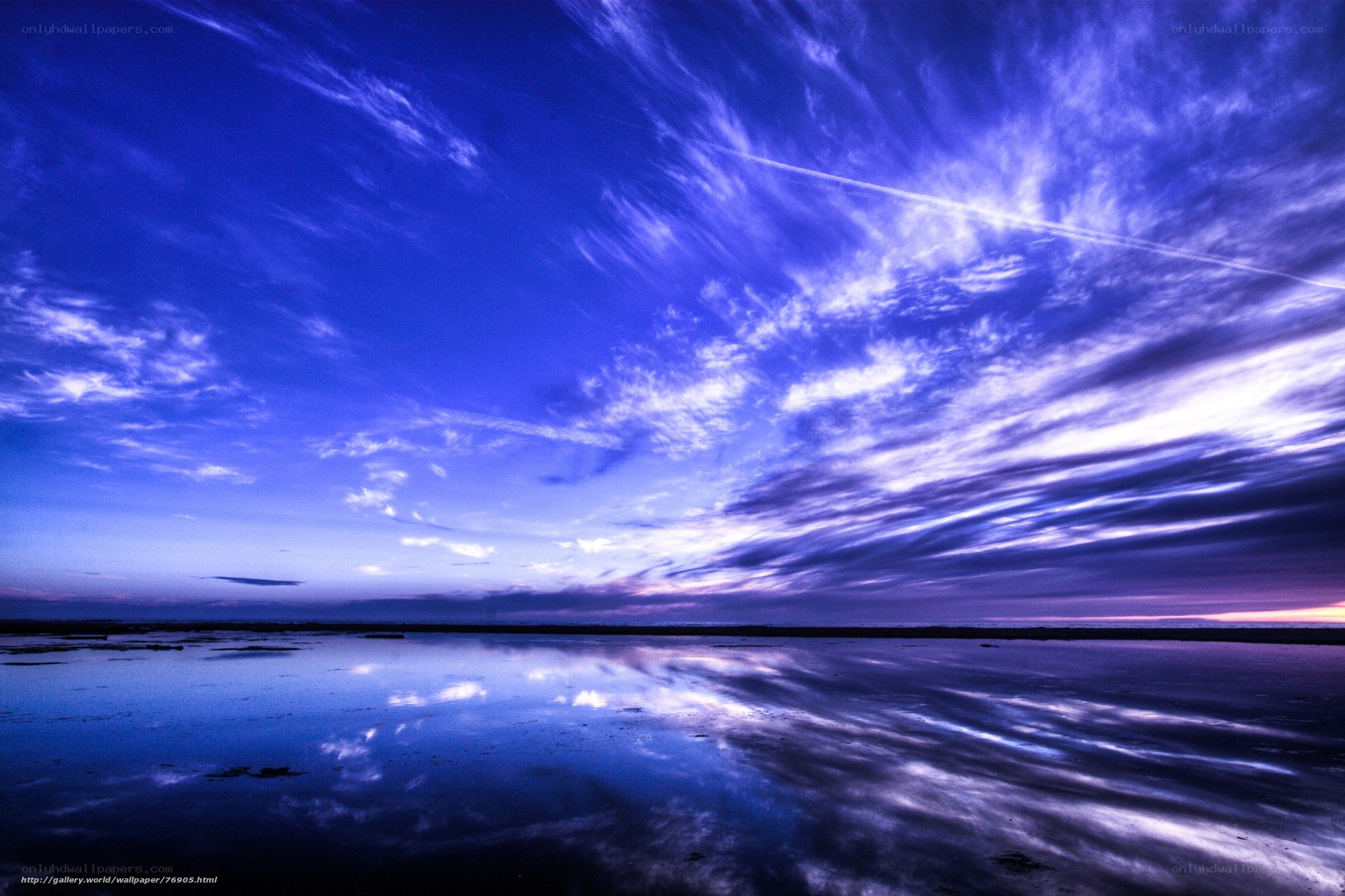 Blue sky over calm water