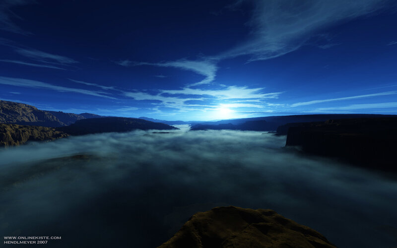 Blue sky over canyon fog