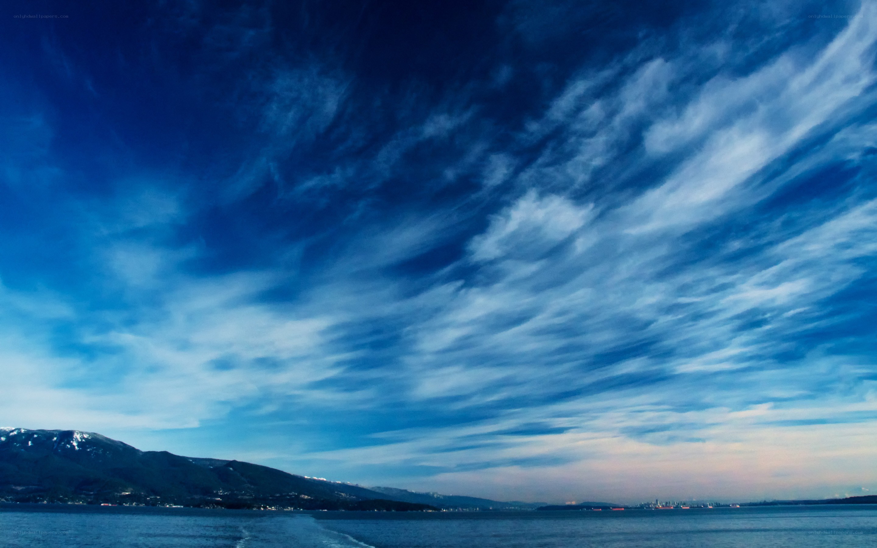 Blue sky over coastal waters