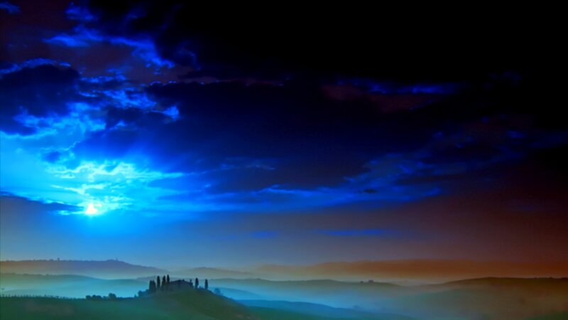 Blue sky over rolling hills