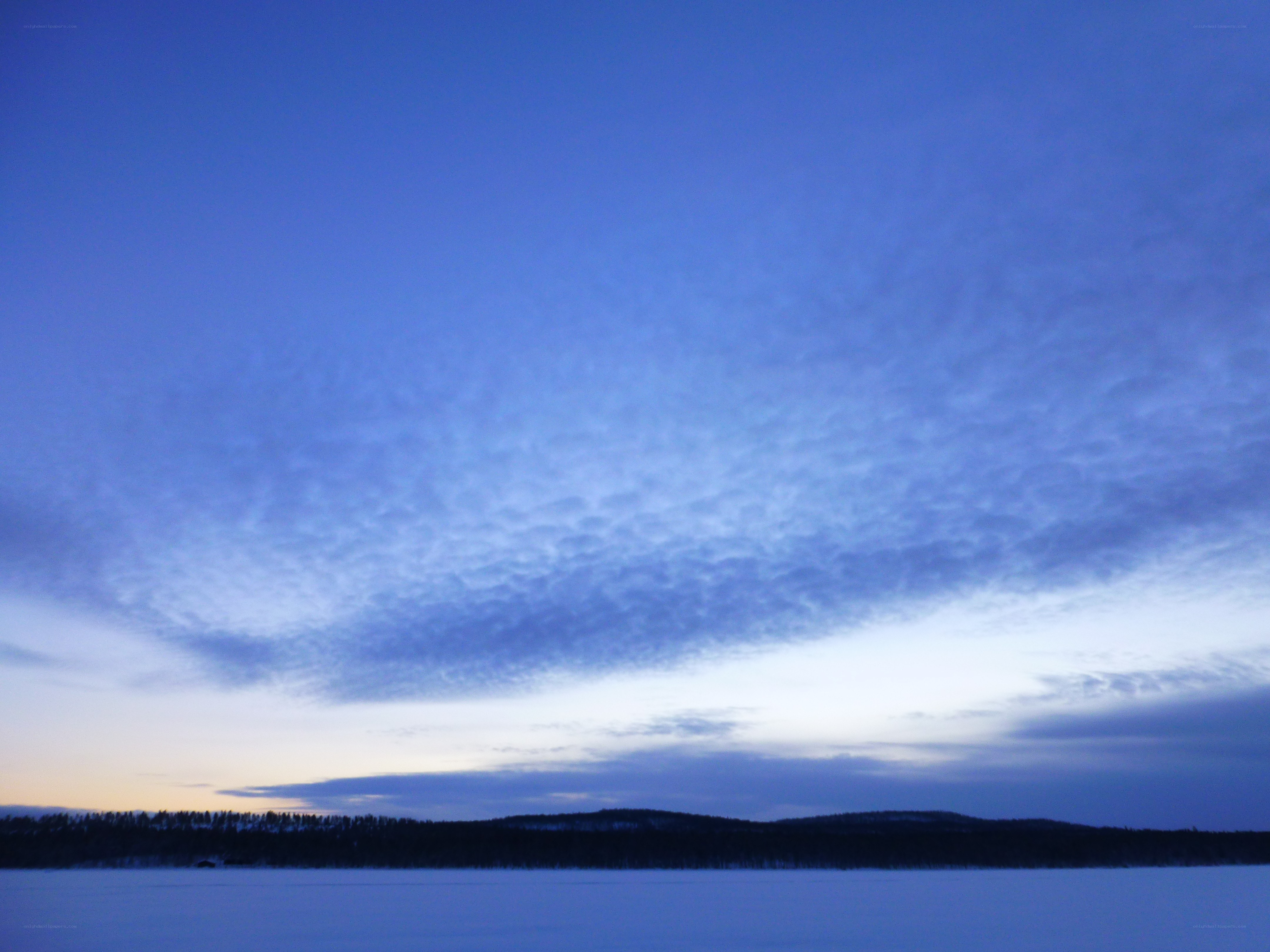 Blue sky over snowy landscape