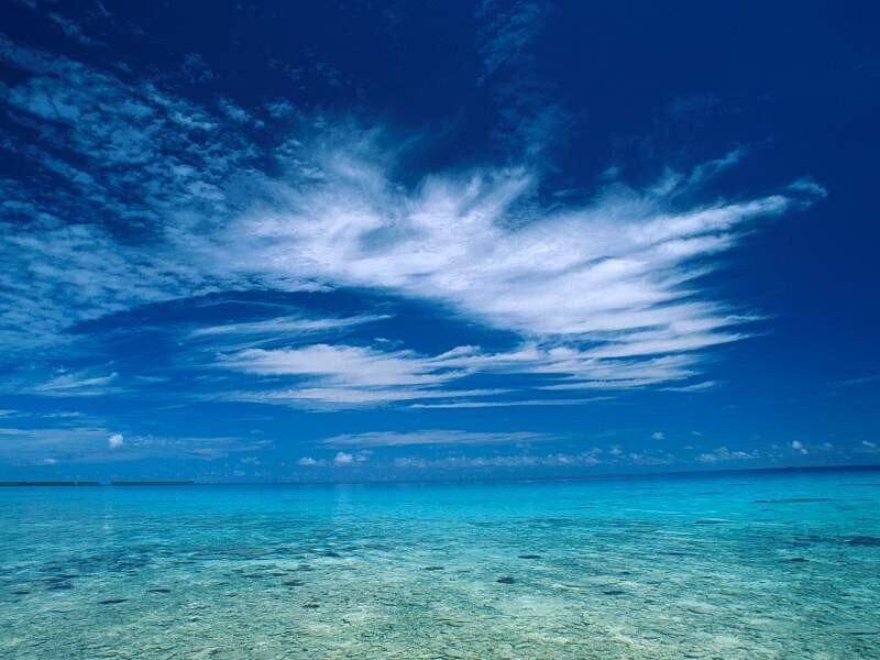 Blue sky over turquoise ocean