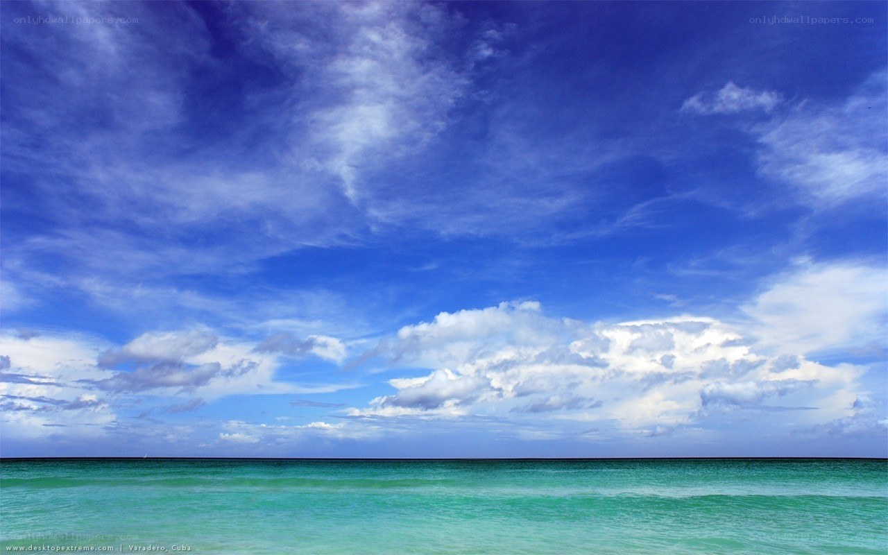 Blue sky over turquoise sea
