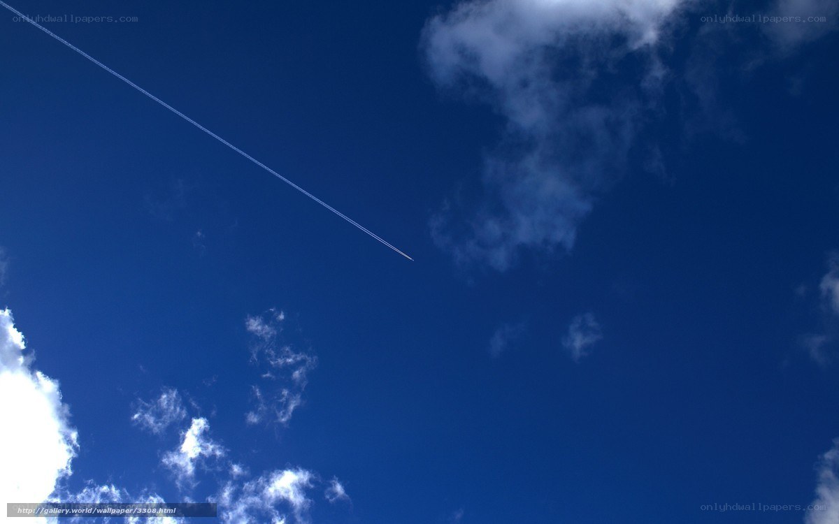 Blue sky with airplane trail